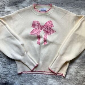 Cream Sweater with Pink Bow Design